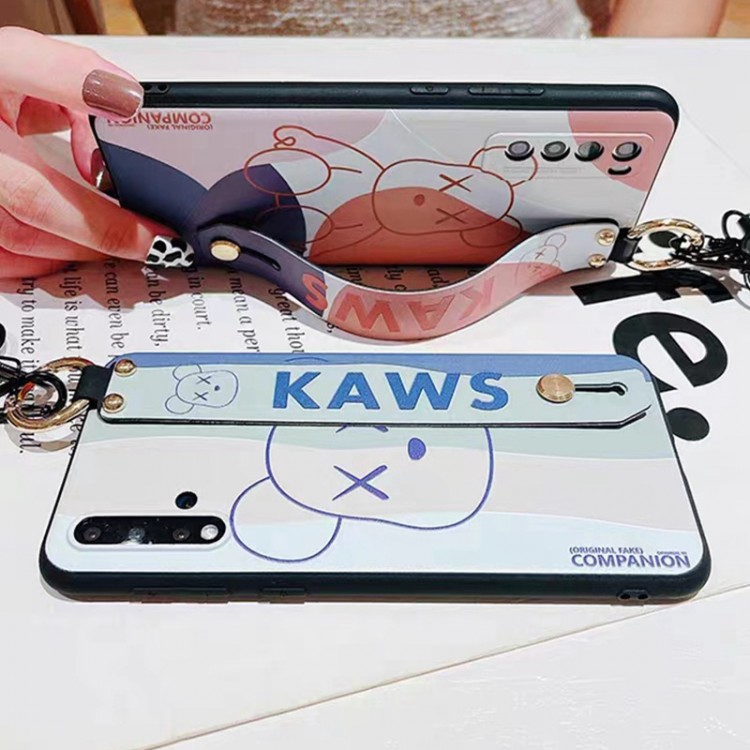 kaws ブランドgalaxy s23/s22/s21+ケースカバー 男女ペアお揃いおしゃれアイフォンiphone14 15 pro max ケーススタンド機能 メンズ レディースsamsung s23 ultra s22 plus s20ケースソフトケース